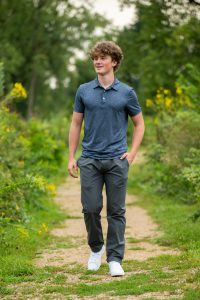 High school senior smiling during outdoor portrait session in Wisconsin