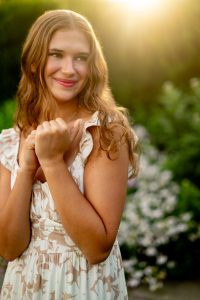 lose-up senior portrait highlighting natural smile and eye contact