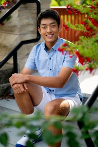 Tight crop senior photo focusing on face and emotion