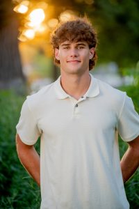 Natural Senior portrait of Graham at sunset