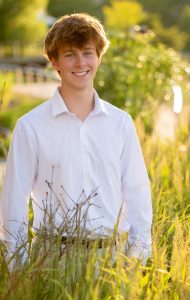 enior portrait featuring confident pose and authentic expression