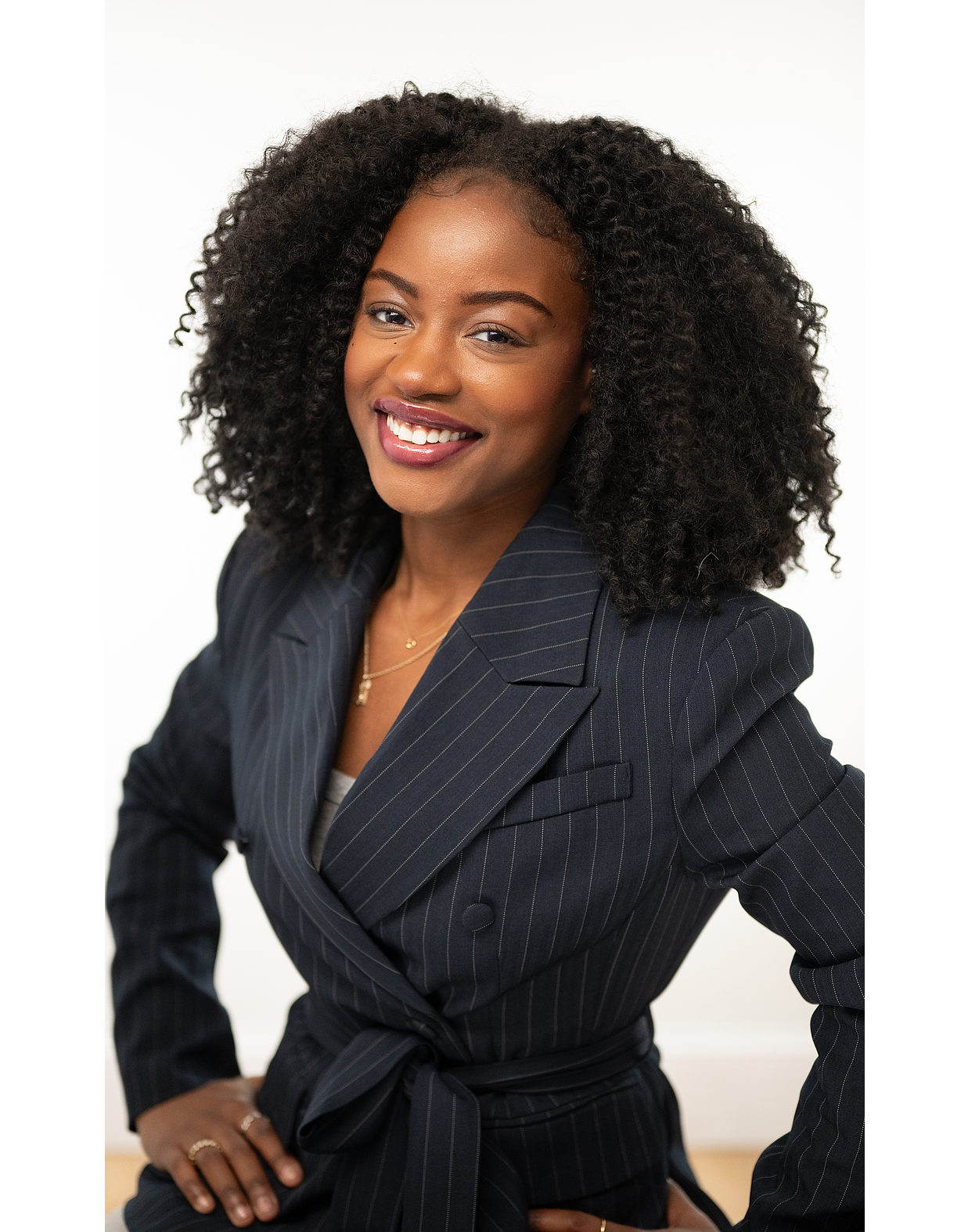 Corporate headshot of Ashley from C-Motive with clean studio lighting and neutral background